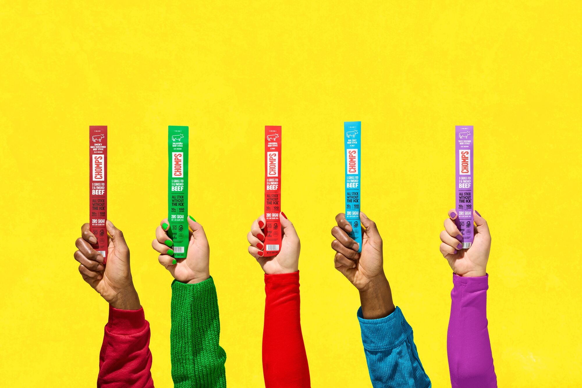 Five hands holding colored boxes against a yellow background