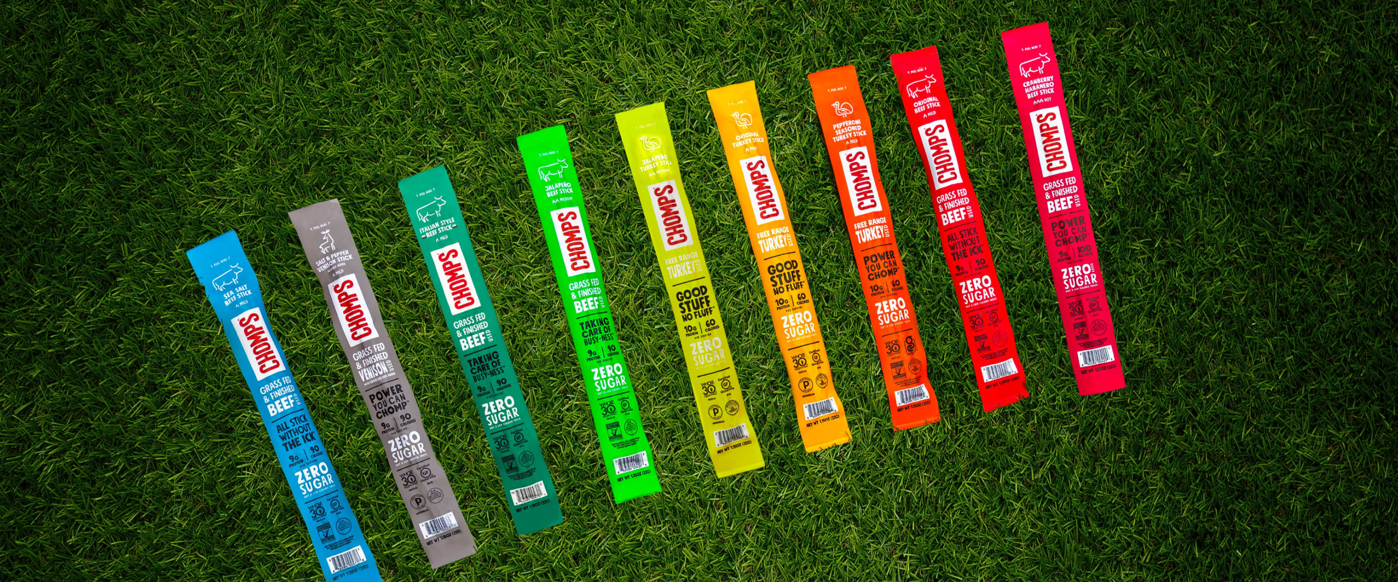 An assortment of Chomps sitting on grass