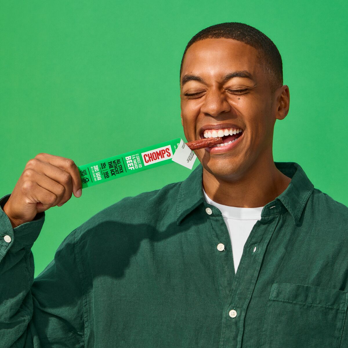 Man enjoying a CHOMPS snack stick