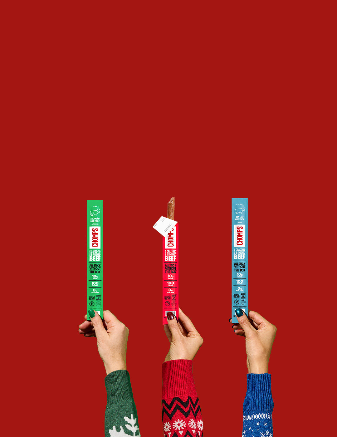 Three hands holding chomps sticks against a red background