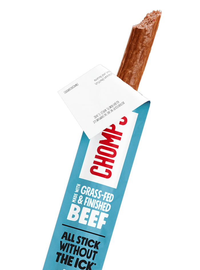 A Chomps sea salt beef stick pulled from its blue and white wrapper