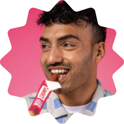 Man holding a Chomps stocl with a pink star-shaped border