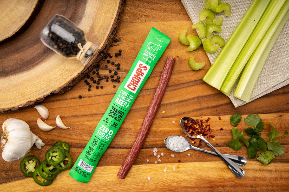 A jalapeno beef Chomps sitting beside its ingredients